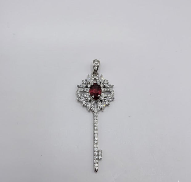 "CLENA" Pendentif avec strass forme clef grenat en argent