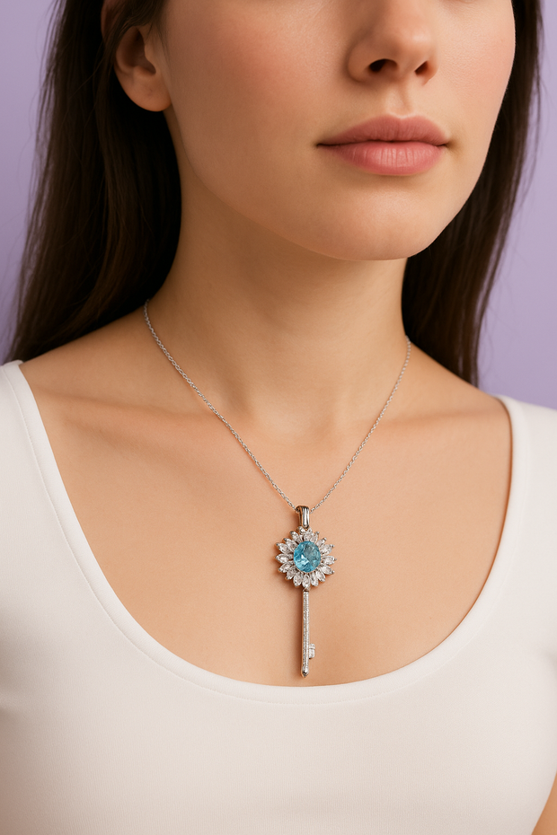 "CLETO" Pendentif avec strass forme clef topaz london en argent